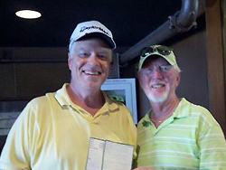 Mike Robinson accepting congratulations from Bill Murray on his Hole-in-One at Tippecanoe tournament.